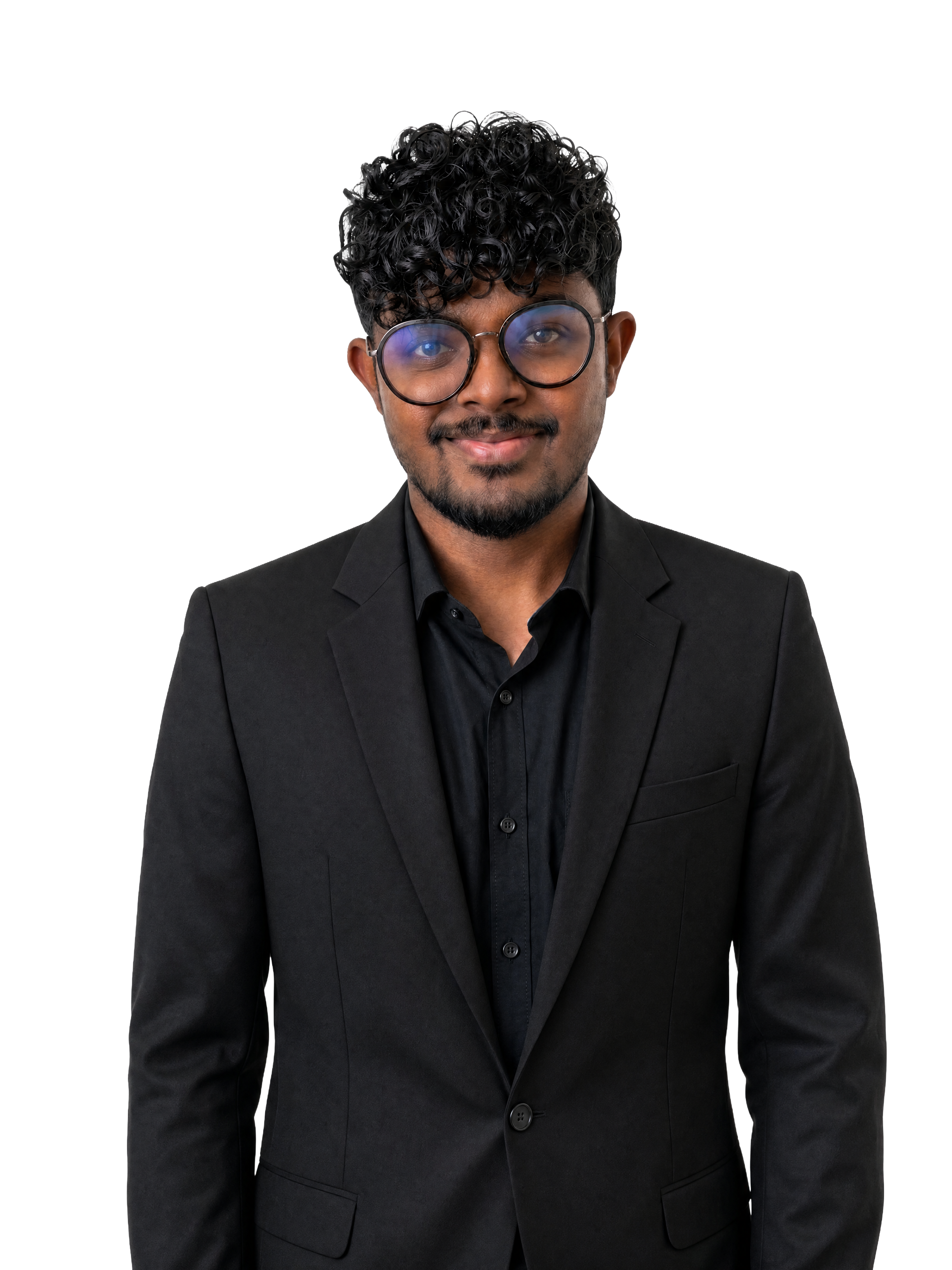 Thilak Srinivas, head and shoulders, in a black blazer and round glasses.